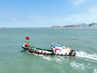 Police aboard a ''Hongfan 110'' boat conduct a maritime patrol operation in Zhoushan, China, on October 1, 2024. (