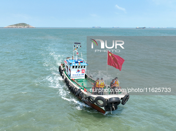 Police aboard a ''Hongfan 110'' boat conduct a maritime patrol operation in Zhoushan, China, on October 1, 2024. 