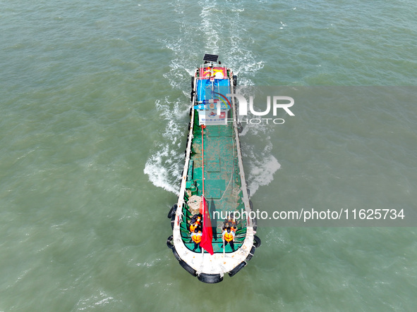 Police aboard a ''Hongfan 110'' boat conduct a maritime patrol operation in Zhoushan, China, on October 1, 2024. 