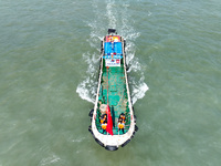 Police aboard a ''Hongfan 110'' boat conduct a maritime patrol operation in Zhoushan, China, on October 1, 2024. (