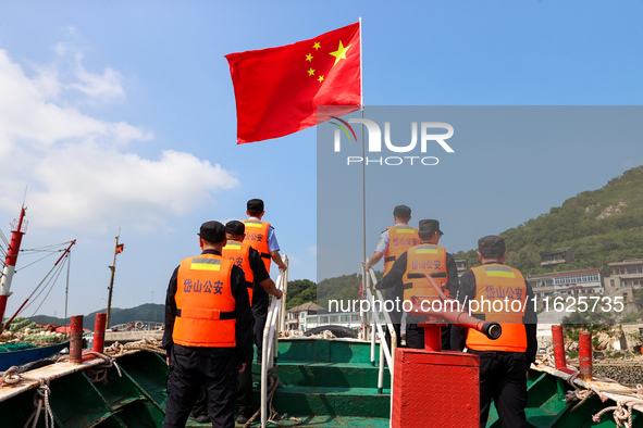 Police aboard a ''Hongfan 110'' boat conduct a maritime patrol operation in Zhoushan, China, on October 1, 2024. 