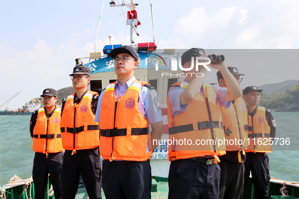 Police aboard a ''Hongfan 110'' boat conduct a maritime patrol operation in Zhoushan, China, on October 1, 2024. 