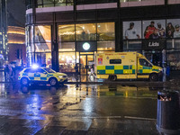 Ambulance in London. Emergency Services Ambulance Vehicle of NHS London Ambulance Service spotted during the night flashing blue light and u...