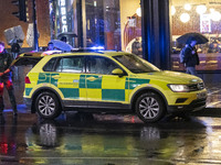 Paramedic, Medical worker and an Ambulance in London. Emergency Services Ambulance Vehicle of NHS London Ambulance Service spotted during th...