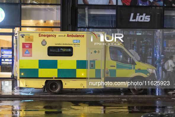 Ambulance in London. Emergency Services Ambulance Vehicle of NHS London Ambulance Service spotted during the night in the streets of Soho in...