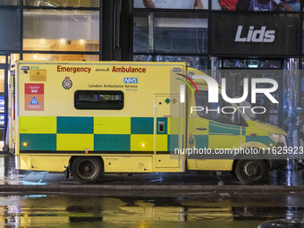 Ambulance in London. Emergency Services Ambulance Vehicle of NHS London Ambulance Service spotted during the night in the streets of Soho in...