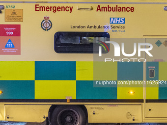 Ambulance in London. Emergency Services Ambulance Vehicle of NHS London Ambulance Service spotted during the night in the streets of Soho in...