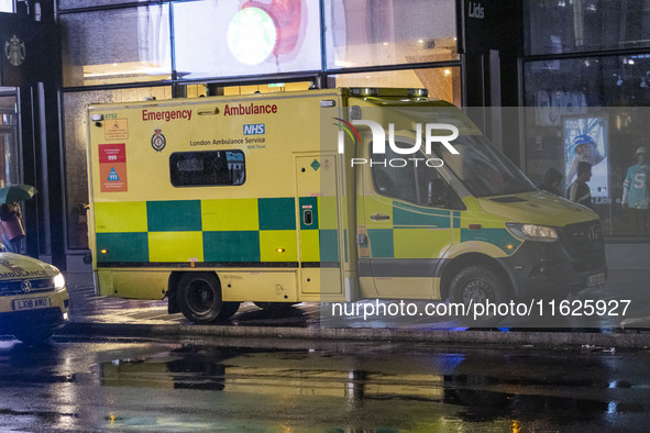 Ambulance in London. Emergency Services Ambulance Vehicle of NHS London Ambulance Service spotted during the night in the streets of Soho in...