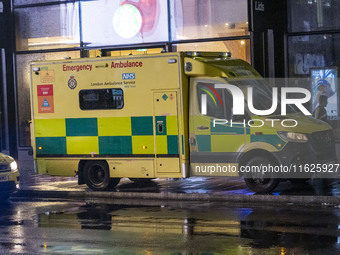 Ambulance in London. Emergency Services Ambulance Vehicle of NHS London Ambulance Service spotted during the night in the streets of Soho in...