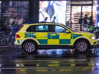 Ambulance in London. Emergency Services Ambulance Vehicle of NHS London Ambulance Service spotted during the night in the streets of Soho in...