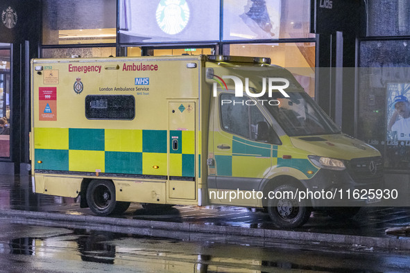 Ambulance in London. Emergency Services Ambulance Vehicle of NHS London Ambulance Service spotted during the night in the streets of Soho in...