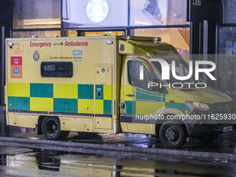 Ambulance in London. Emergency Services Ambulance Vehicle of NHS London Ambulance Service spotted during the night in the streets of Soho in...