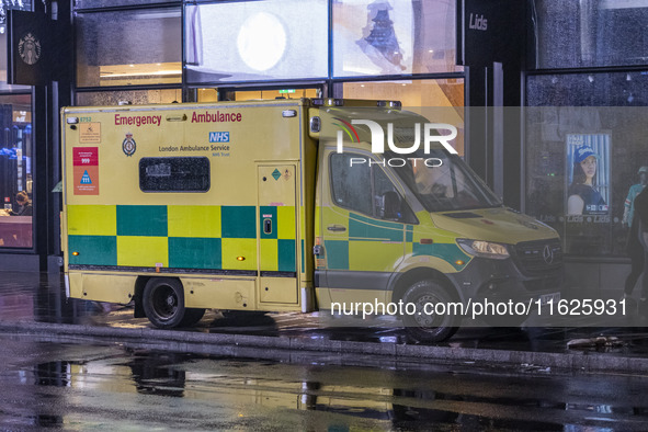 Ambulance in London. Emergency Services Ambulance Vehicle of NHS London Ambulance Service spotted during the night in the streets of Soho in...