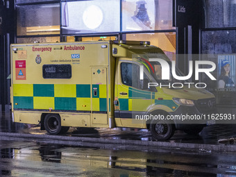 Ambulance in London. Emergency Services Ambulance Vehicle of NHS London Ambulance Service spotted during the night in the streets of Soho in...