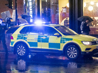 Paramedic, Medical worker next to an Ambulance in London. Emergency Services Ambulance Vehicle of NHS London Ambulance Service spotted durin...