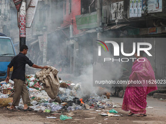 People face significant challenges while crossing the street due to air pollution, which adversely affects their health and daily lives in D...