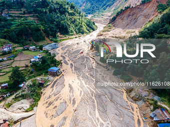 The aerial view shows the flood-affected areas of the Nakhu River in the Tikabhairab region of southern Lalitpur, Nepal, on October 01, 2024...