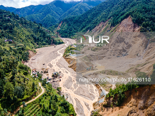 The aerial view shows the flood-affected areas of the Nakhu River in the Tikabhairab region of southern Lalitpur, Nepal, on October 01, 2024...