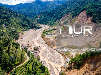 The aerial view shows the flood-affected areas of the Nakhu River in the Tikabhairab region of southern Lalitpur, Nepal, on October 01, 2024...