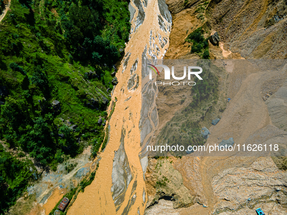 The aerial view shows the flood-affected areas of the Nakhu River in the Tikabhairab region of southern Lalitpur, Nepal, on October 01, 2024...