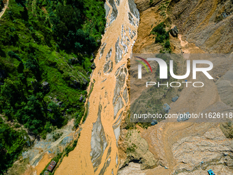 The aerial view shows the flood-affected areas of the Nakhu River in the Tikabhairab region of southern Lalitpur, Nepal, on October 01, 2024...