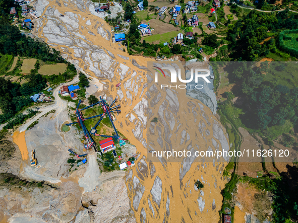 The aerial view shows the flood-affected areas of the Nakhu River in the Tikabhairab region of southern Lalitpur, Nepal, on October 01, 2024...