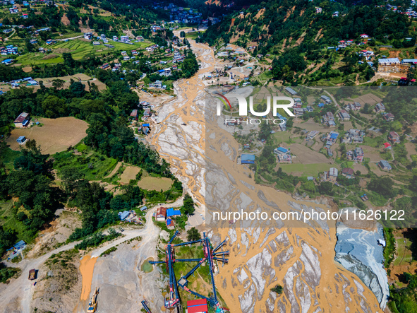 The aerial view shows the flood-affected areas of the Nakhu River in the Tikabhairab region of southern Lalitpur, Nepal, on October 1, 2024....