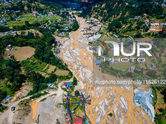 The aerial view shows the flood-affected areas of the Nakhu River in the Tikabhairab region of southern Lalitpur, Nepal, on October 1, 2024....