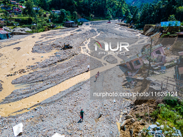 The aerial view shows the flood-affected areas of the Nakhu River in the Tikabhairab region of southern Lalitpur, Nepal, on October 01, 2024...