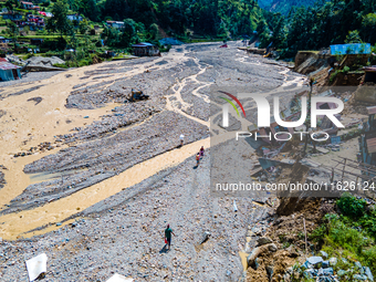 The aerial view shows the flood-affected areas of the Nakhu River in the Tikabhairab region of southern Lalitpur, Nepal, on October 01, 2024...