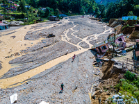 The aerial view shows the flood-affected areas of the Nakhu River in the Tikabhairab region of southern Lalitpur, Nepal, on October 01, 2024...