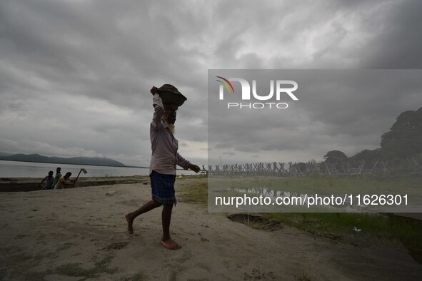 Rain clouds loom over the Brahmaputra River in Guwahati, Assam, India, on May 25, 2018. 