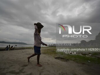 Rain clouds loom over the Brahmaputra River in Guwahati, Assam, India, on May 25, 2018. (