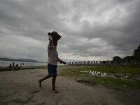 Rain clouds loom over the Brahmaputra River in Guwahati, Assam, India, on May 25, 2018. (