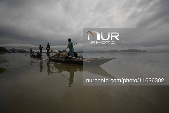 Rain clouds loom over the Brahmaputra River in Guwahati, Assam, India, on May 25, 2018. 