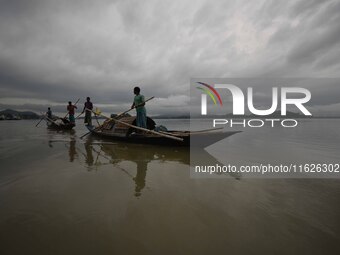 Rain clouds loom over the Brahmaputra River in Guwahati, Assam, India, on May 25, 2018. (