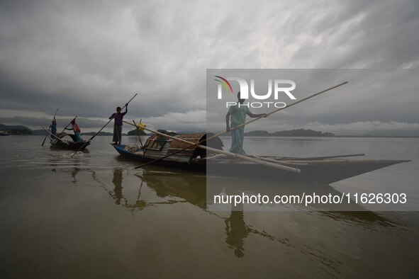 Rain clouds loom over the Brahmaputra River in Guwahati, Assam, India, on May 25, 2018. 