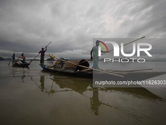 Rain clouds loom over the Brahmaputra River in Guwahati, Assam, India, on May 25, 2018. (