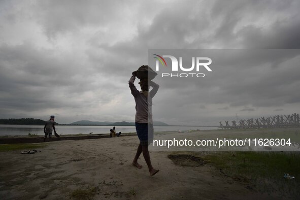 Rain clouds loom over the Brahmaputra River in Guwahati, Assam, India, on May 25, 2018. 