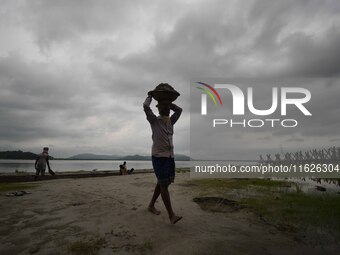 Rain clouds loom over the Brahmaputra River in Guwahati, Assam, India, on May 25, 2018. (