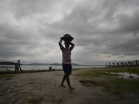 Rain clouds loom over the Brahmaputra River in Guwahati, Assam, India, on May 25, 2018. (