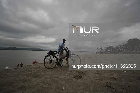 Rain clouds loom over the Brahmaputra River in Guwahati, Assam, India, on May 25, 2018. 