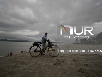 Rain clouds loom over the Brahmaputra River in Guwahati, Assam, India, on May 25, 2018. (