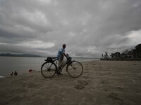 Rain clouds loom over the Brahmaputra River in Guwahati, Assam, India, on May 25, 2018. (