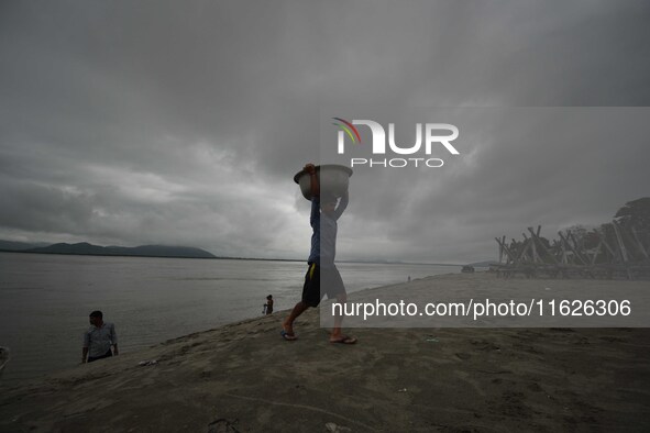 Rain clouds loom over the Brahmaputra River in Guwahati, Assam, India, on May 25, 2018. 