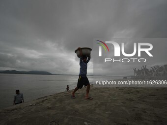 Rain clouds loom over the Brahmaputra River in Guwahati, Assam, India, on May 25, 2018. (