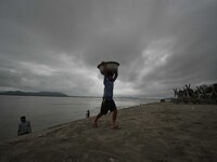 Rain clouds loom over the Brahmaputra River in Guwahati, Assam, India, on May 25, 2018. (