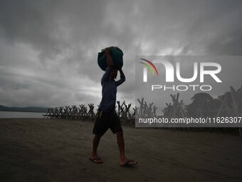 Rain clouds loom over the Brahmaputra River in Guwahati, Assam, India, on May 25, 2018. (