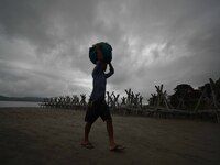 Rain clouds loom over the Brahmaputra River in Guwahati, Assam, India, on May 25, 2018. (