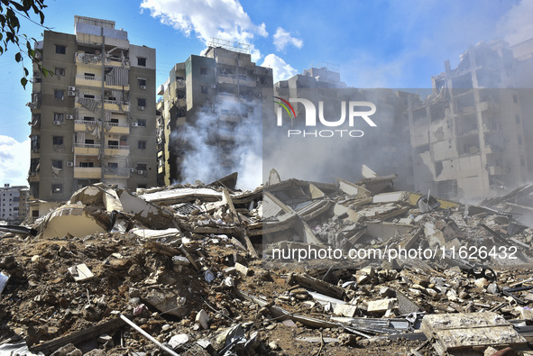 The destruction at the site of an overnight Israeli airstrike on the Laylaki, Harat Hreik, and Sant Tares neighborhoods in Beirut's southern...